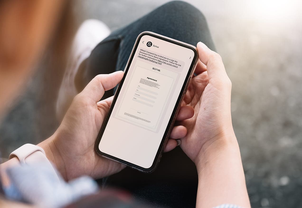 a man consults an electronic contract on his telephone